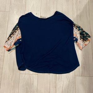 Soft blue top with patterned sleeves